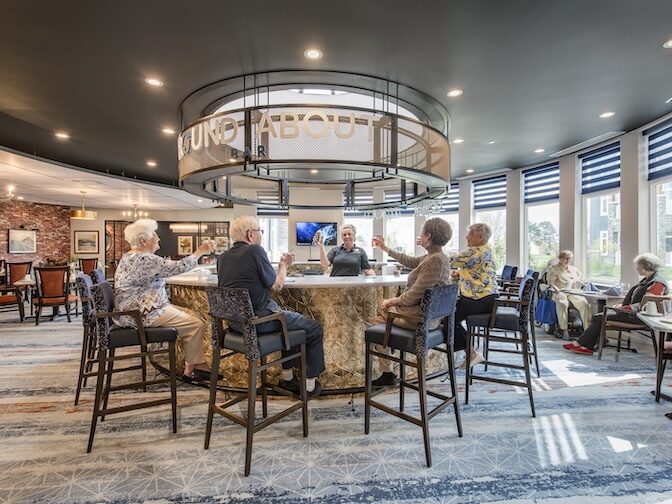 a group of seniors enjoying a happy hour in a modern rustic pub