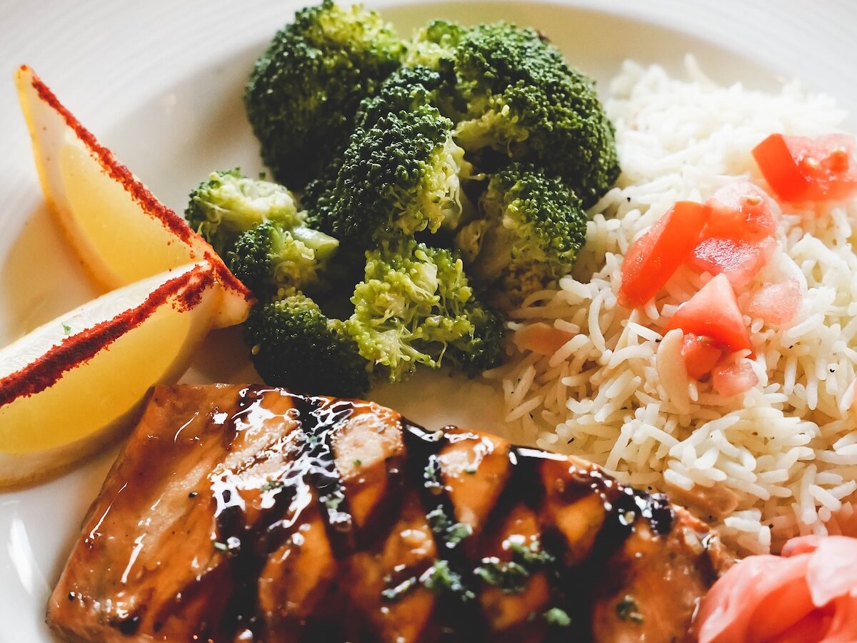 a plate full of fresh, delicious, and colorful salmon and broccoli